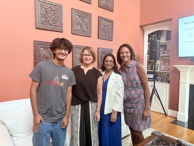 Four people standing together at a Wake Teen Dems community gathering