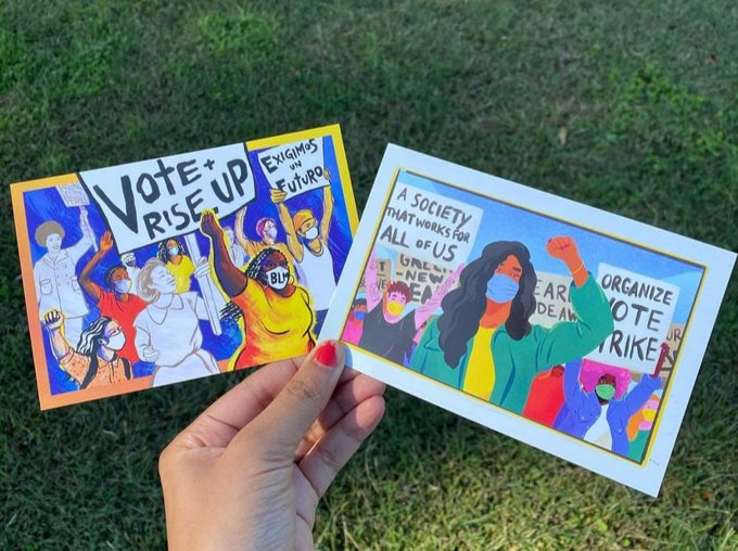 A hand holding two colorful postcards encouraging civic action and voting