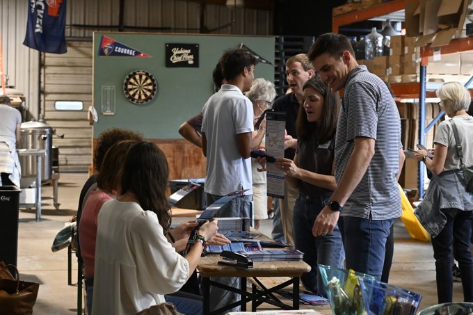 Connecting around the resource table at the October 2026 Wake Dems event