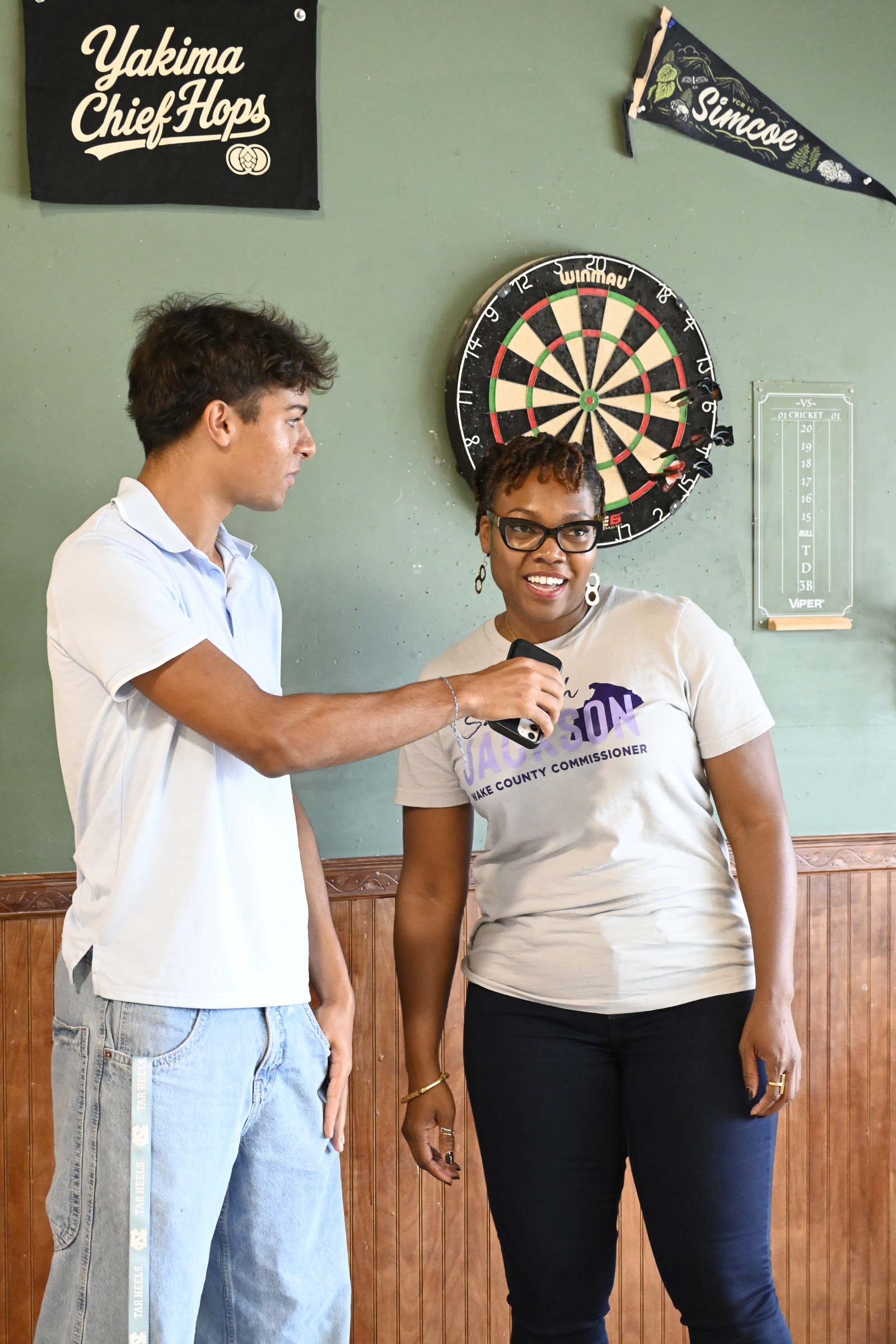 A Wake Teen Dems member asking questions at a community event