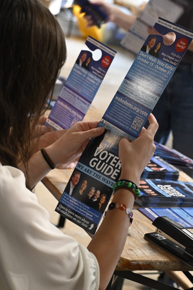 Exploring information at the table at the October 2026 Wake Dems event